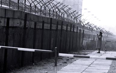 a picture of a west berliner talking over the berlin wall to an east berliner in 1962. - (photo: nato handout / getty images)